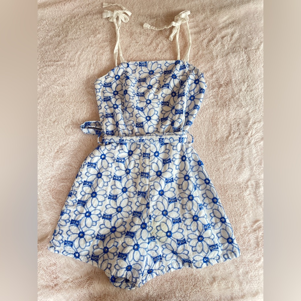 Francesca’s Miami blue and white floral romper